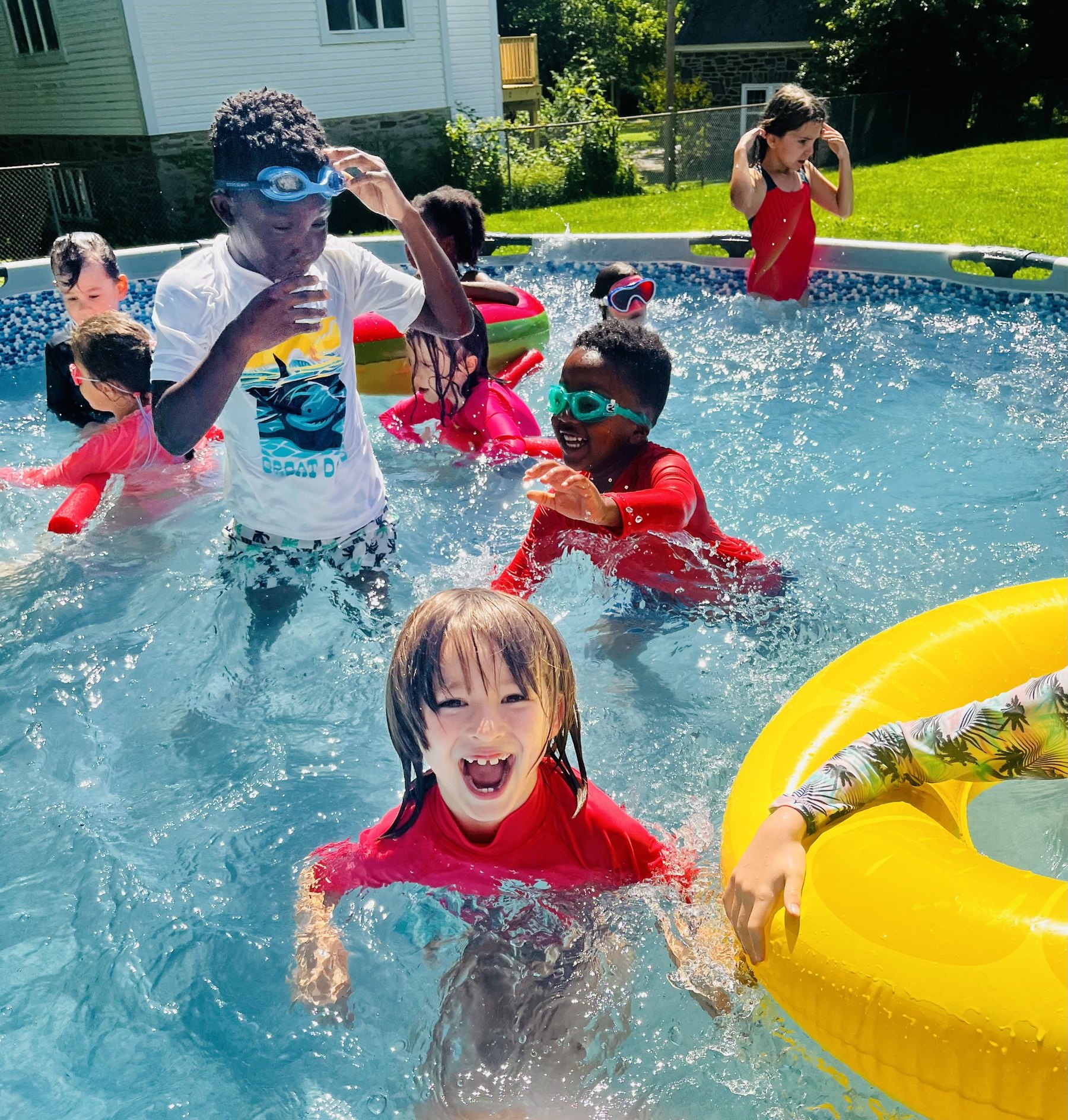 Campers enjoying water games at French for Fun Summer Camp