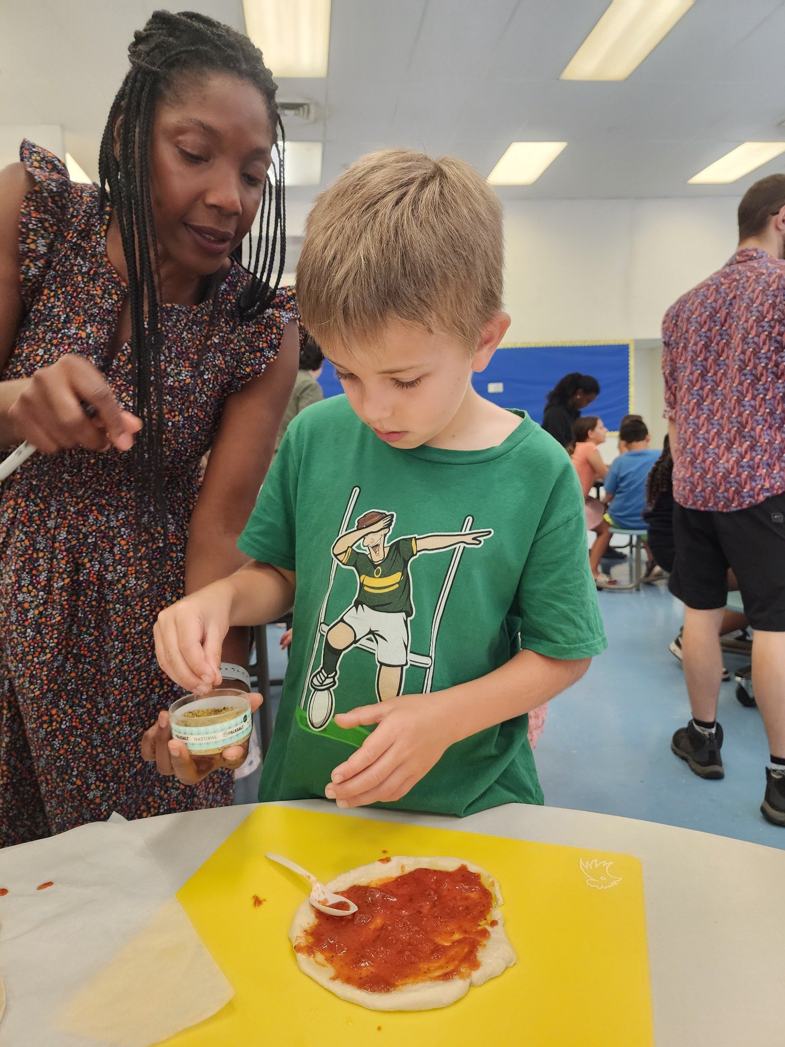 A French for Fun teacher guiding campers through a hands-on activity