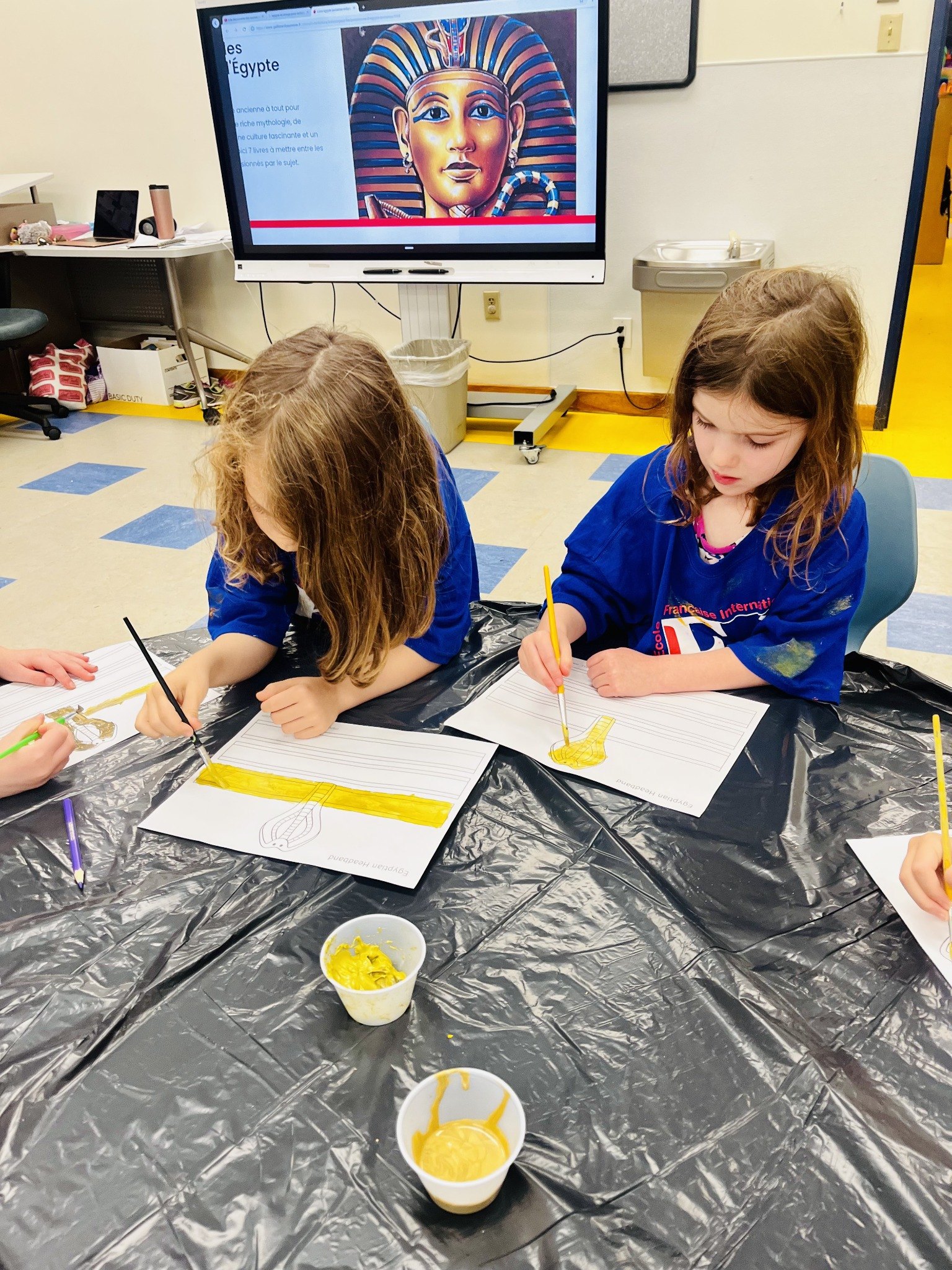Campers painting during an ancient Egypt themed activity